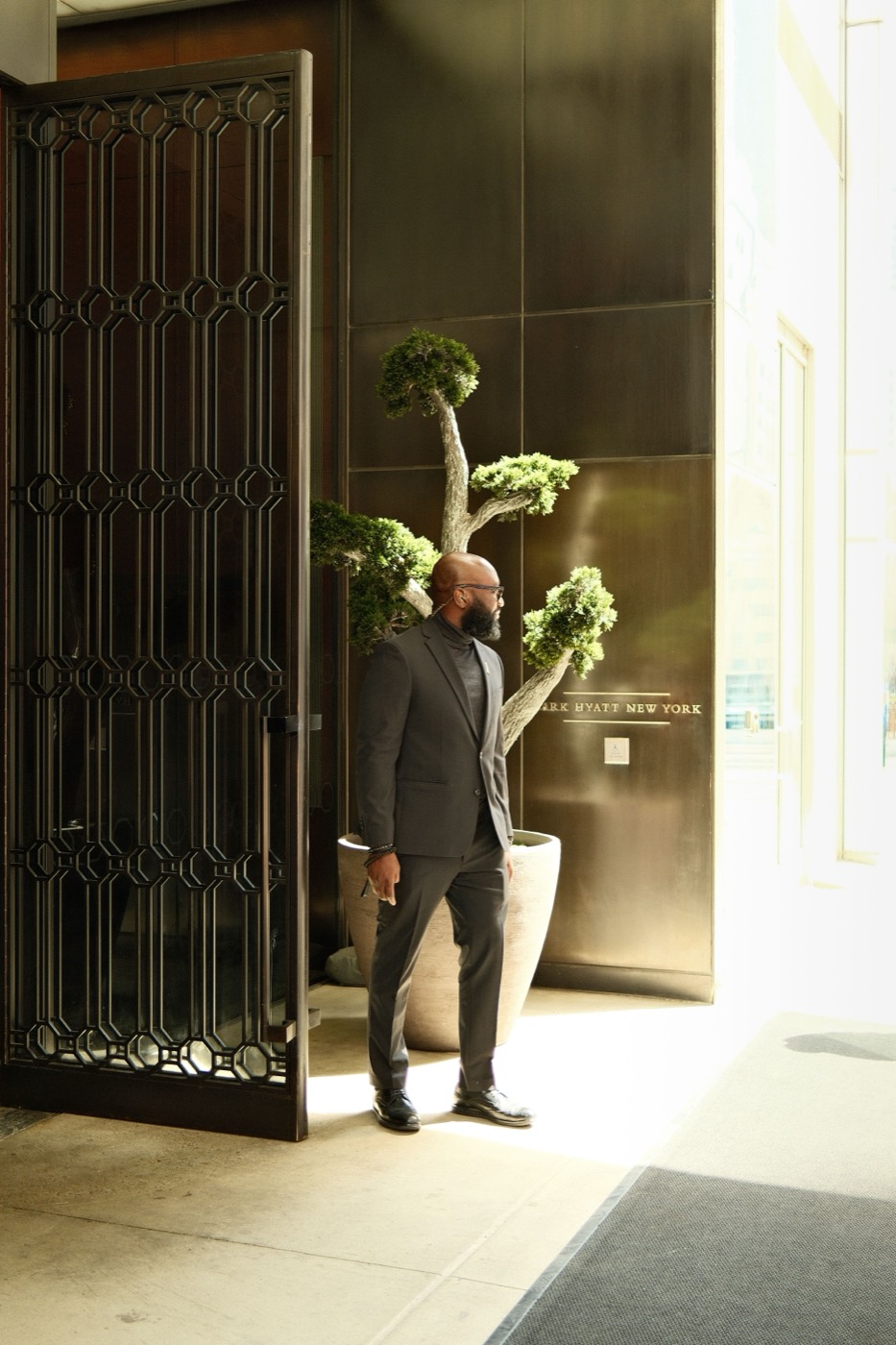 Concierge greeting a resident at the building entrance