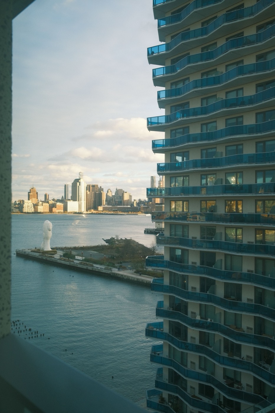 Waterfront residential tower with amenity deck